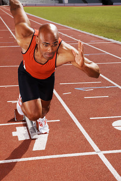 istock The start - African American runner on running track 182792912