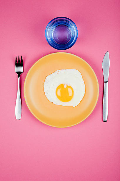 istock Yellow plate with egg on colorful backround 182793800