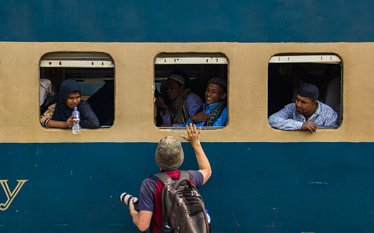 Yangon, Myanmar - December 31, 2012: Train stopped at the station letting people off in Yangon, Myanmar.