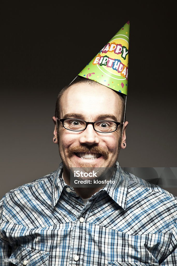 Birthday. Yippee. Male with checkered shirt and mustache wears a birthday hat and an excited expression. Adult Stock Photo