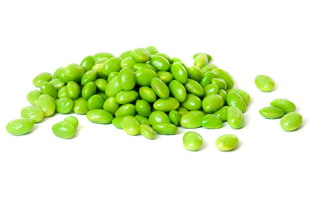 A heap of soybeans on white background stock photo