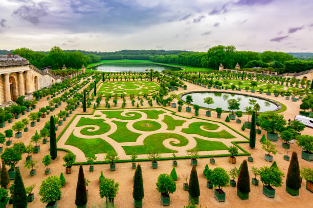 Versailles formal gardens (Orangery) outside Paris at sunset, France stock photo