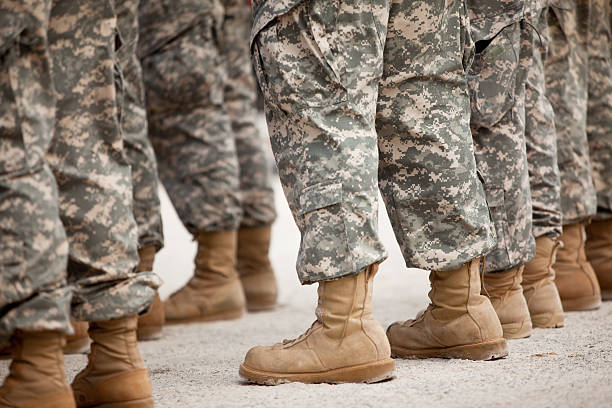 Soldiers in formation Troops in formation. national guard stock pictures, royalty-free photos & images