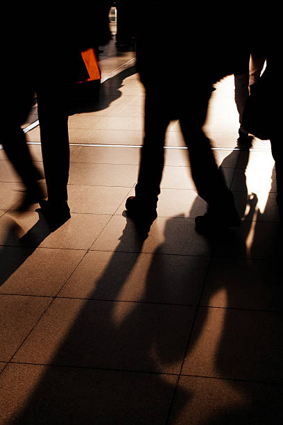 istock Shadows and Silhouettes of Commuters Walking to Work 182794417