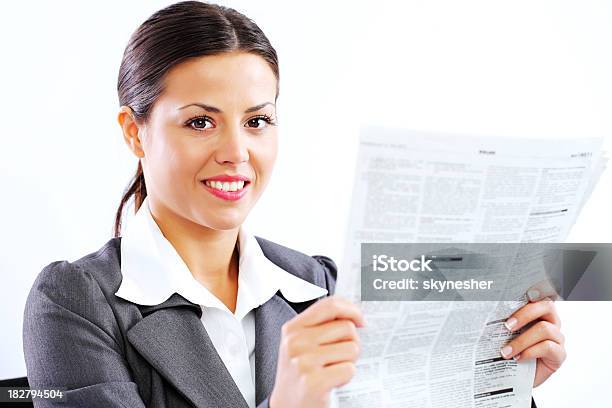 Business Woman Holding Newspaper Looking At Camera Stock Photo - Download Image Now