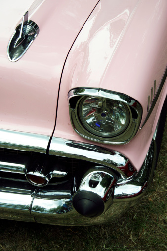 Part of a pink american oldtimer.