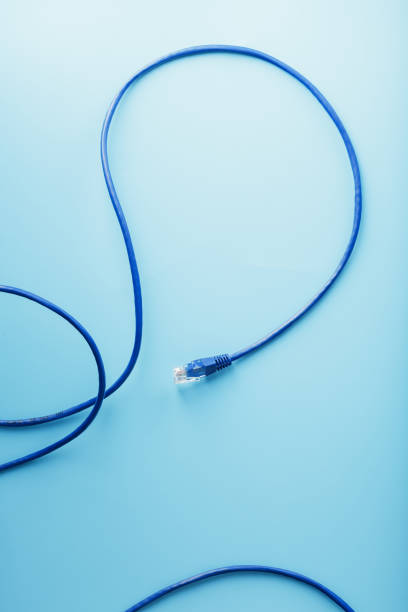 istock Blue Ethernet Cable Cord Patch cord on a blue background with free space 1827949395