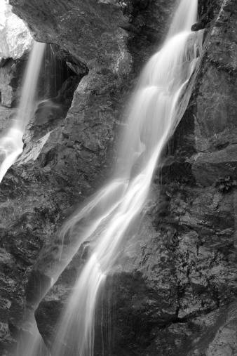 Waterfall cascading down mountain side