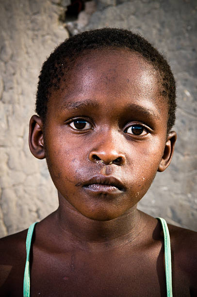 istock Young Xhosa girl infront of mud wall 182795430