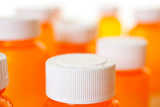 istock Group of orange medicine bottles with lids 182795559