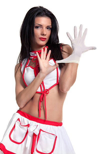Sexy nurse Sexy nurse putting protective gloves on her hand. Isolated on white background. Some photos from same series: sex symbol stock pictures, royalty-free photos & images