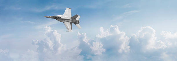 F-18 Fighter Jet Panorama Panoramic view of an F-18 fighter jet cutting across the sky. hornet stock pictures, royalty-free photos & images