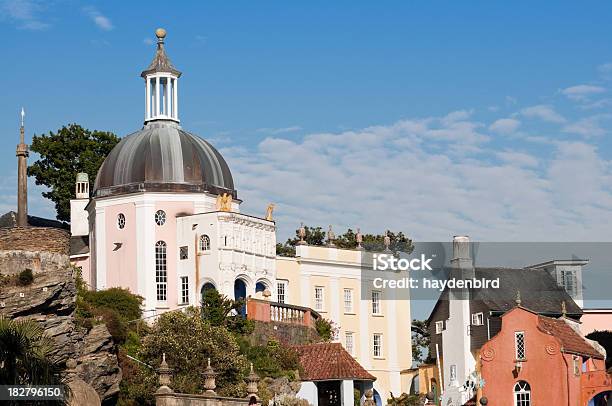 Italian Style Buildings Built Into Rock Face Portmeirion Stock Photo - Download Image Now