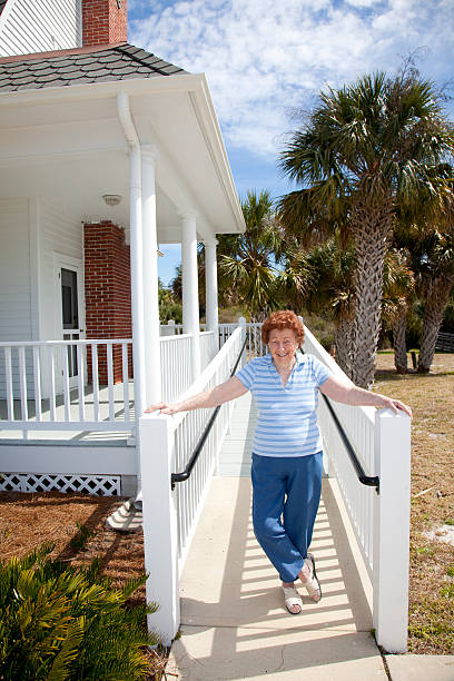 Woman by house stock photo