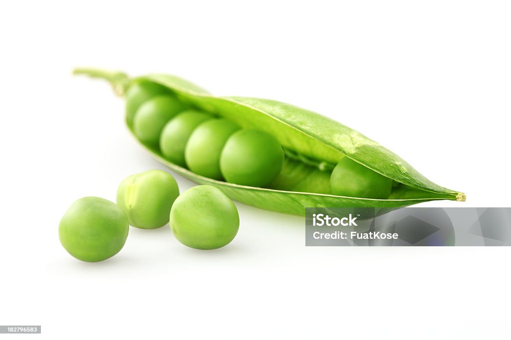 A fresh green pea pod on a white background Fresh green pea isolated on white background Green Pea Stock Photo
