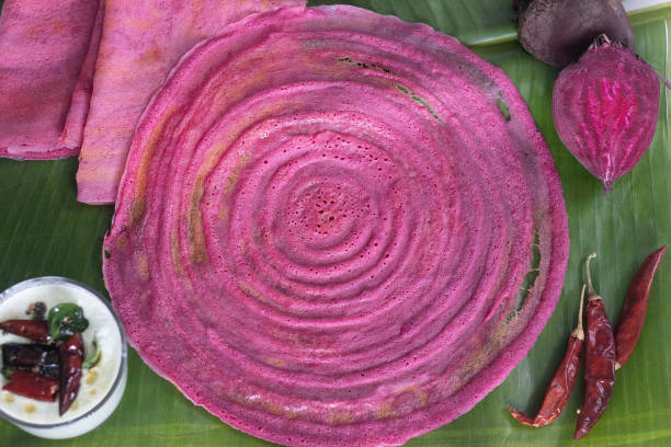 Beetroot ghee roast. A colorful, flavorful South Indian Crispy crapes made with fermented batter of rice and lentils mixed with beetroot