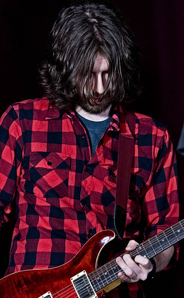 istock Male Guitar Player Jamming Away 182796759