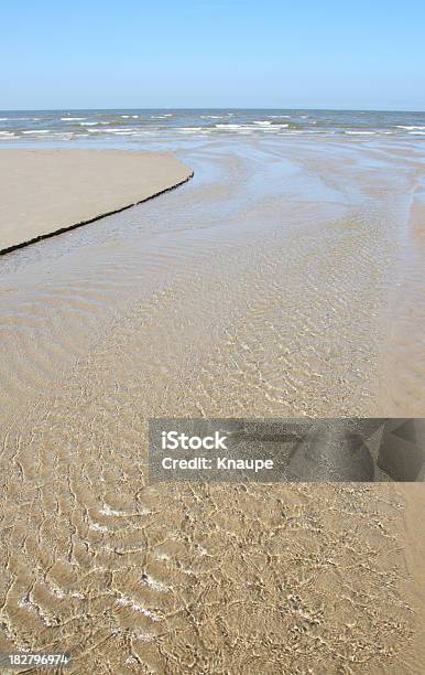 Flowing Water On Sandy Beach At North Sea Stock Photo - Download Image Now - Beach, Clear Sky, Coastline