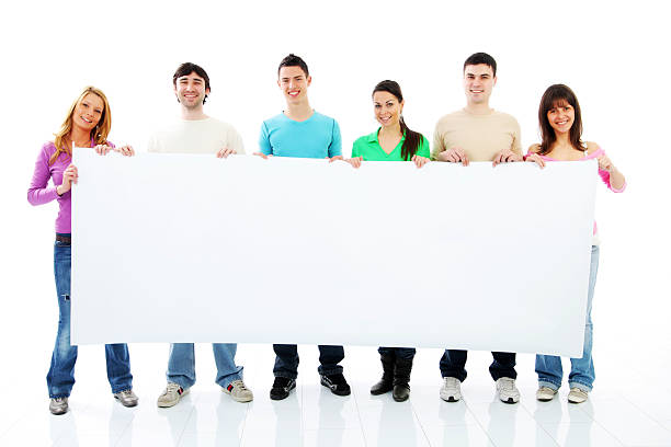 istock Group of a happy young people holing big empty paper. 182797121