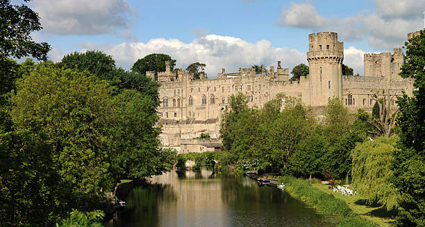 Warwick Castle. A view of the magnificent Warwick Castle from a bridge over the river Avon. Large file. warwick uk stock pictures, royalty-free photos & images