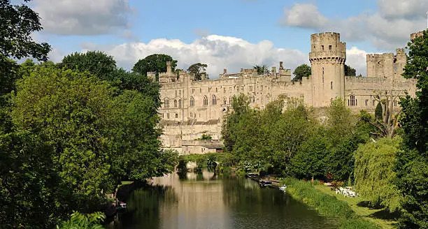 A view of the magnificent Warwick Castle from a bridge over the river Avon. Large file.