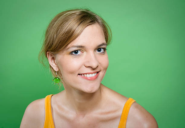 istock Young woman and green background 182797565