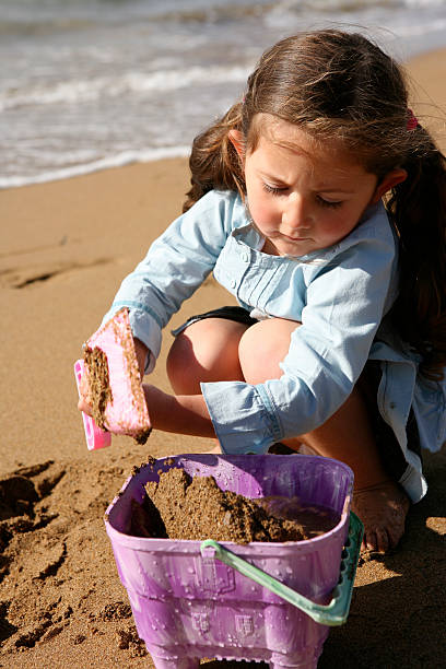 istock Nice little girl playing on the beach 182798163