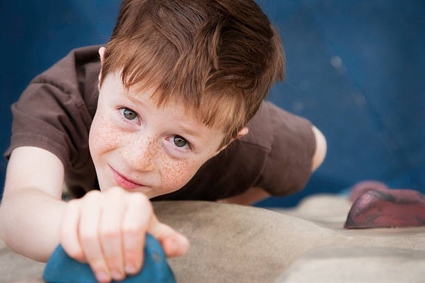 istock Little Boy on Climbing Wall at Playground 182798268