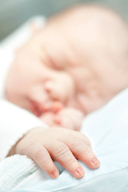 istock newborns little hand 182798654