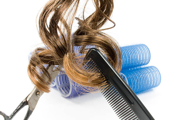 istock hairdressing cut with hair and comb 182798732