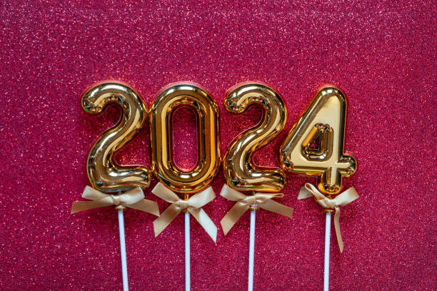 istock New Year 2024 - Orange old gold numbers on on glitter background 1827994559