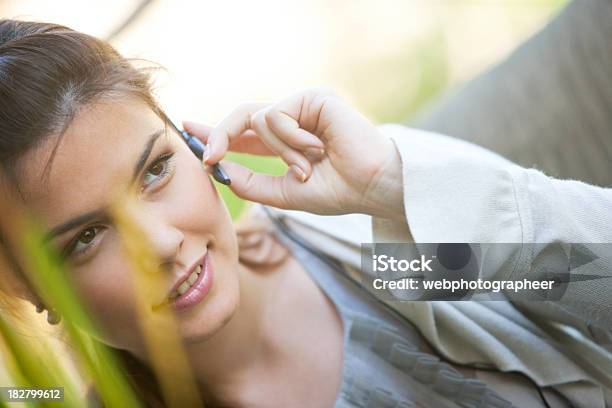 Woman Using Headset Stock Photo - Download Image Now - Adult, Adults Only, Bluetooth