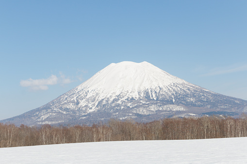 Snowcapped Mount Yotei stratovolcano mountain in Japanese winter landscape