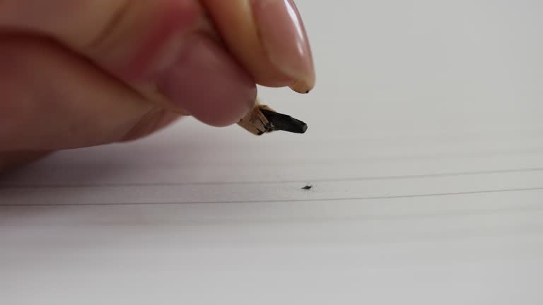 Pencil lead breaks pressed by paper