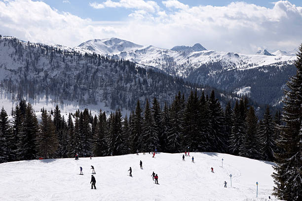 istock snow-covered ski slope in the Austrian Alps 182800681