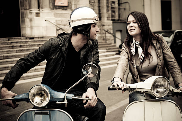 istock Happy young couple over scooters 182800722