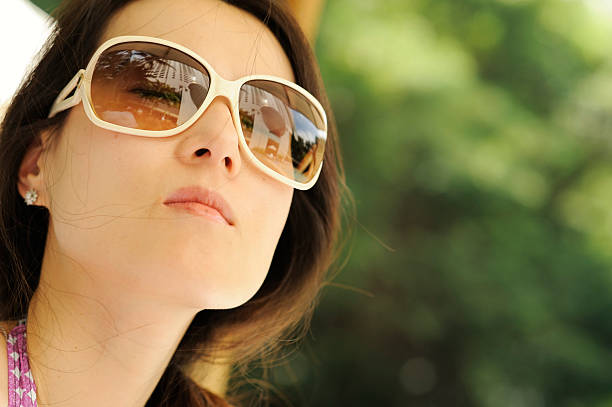 istock Young woman relaxing in the pool side 182800882