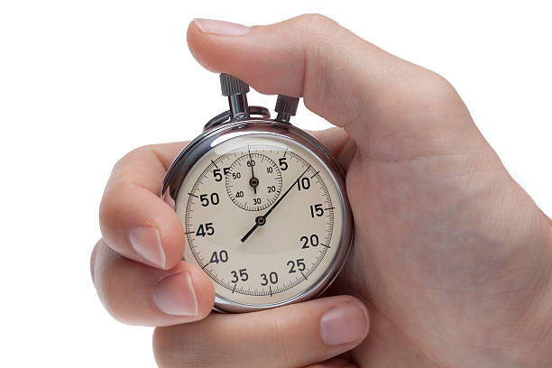 istock stop watch in male fingers 182800970