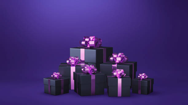 istock Black gift boxes with pink ribbon on purple background 1828013626