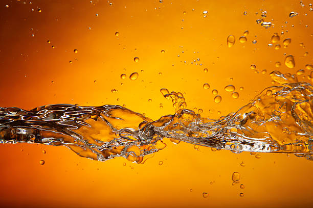 istock A splash of water on a bright orange background 182801710