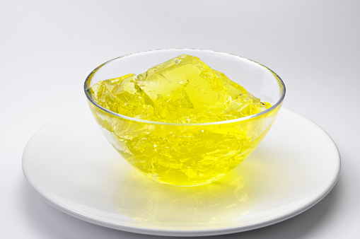 Yellow jelly with lemon flavor in a glass bowl