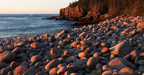 istock Beach Rocks Glow Golden in the Sunrise 182802527