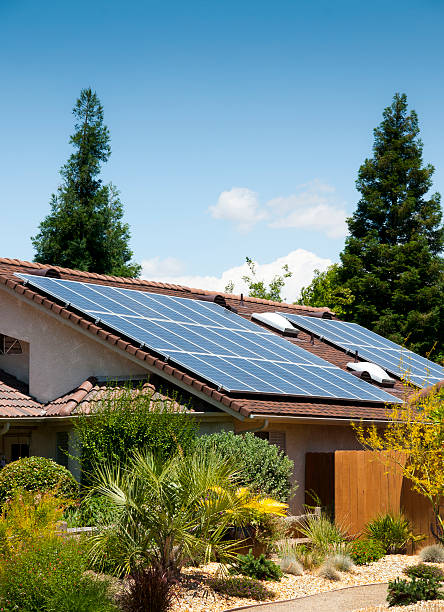 Solar Panels Side View Southwestern styled home with side solar panels. solar power station solar panel house solar energy stock pictures, royalty-free photos & images