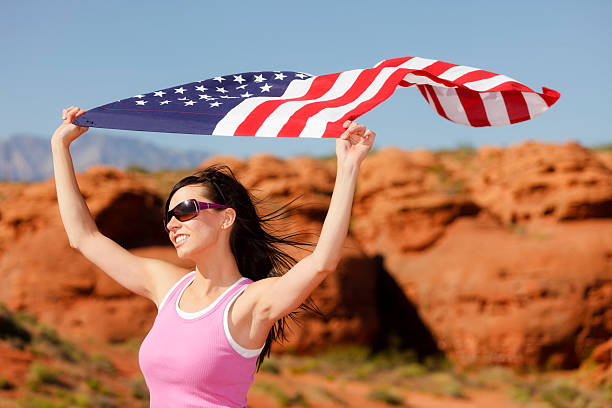 istock Pretty Young Woman with American Flag 182803200