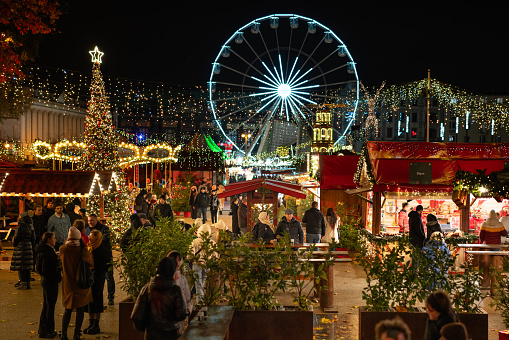 Poland, Greater Poland, Poznan, December 01, 2023. Christmas market in the center of Poznań. Ferris wheel in the background