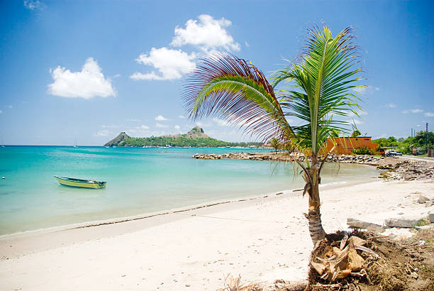 beautiful island - St Lucia. beach with fishing boat on turquoise water.