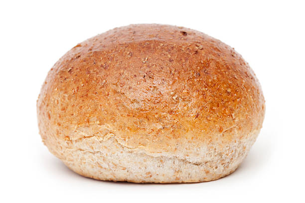 Close-up of whole meal bread on white background stock photo