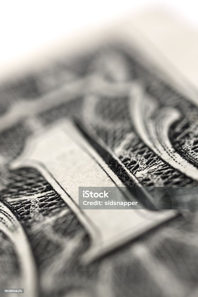 Figure One on a tightly cropped dollar bill "Very tightly cropped image of a dollar bill with  shallow depth of field, selected focus on the numeral one.Other business and financial ideas" American One Dollar Bill Stock Photo