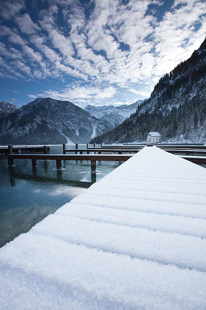 istock lake plansee in winter- tirol -austria 182804655