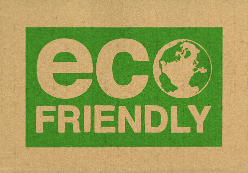 Eco friendly and earth stamped on to the side of recycled cardboard in green ink. Earth created by myself.